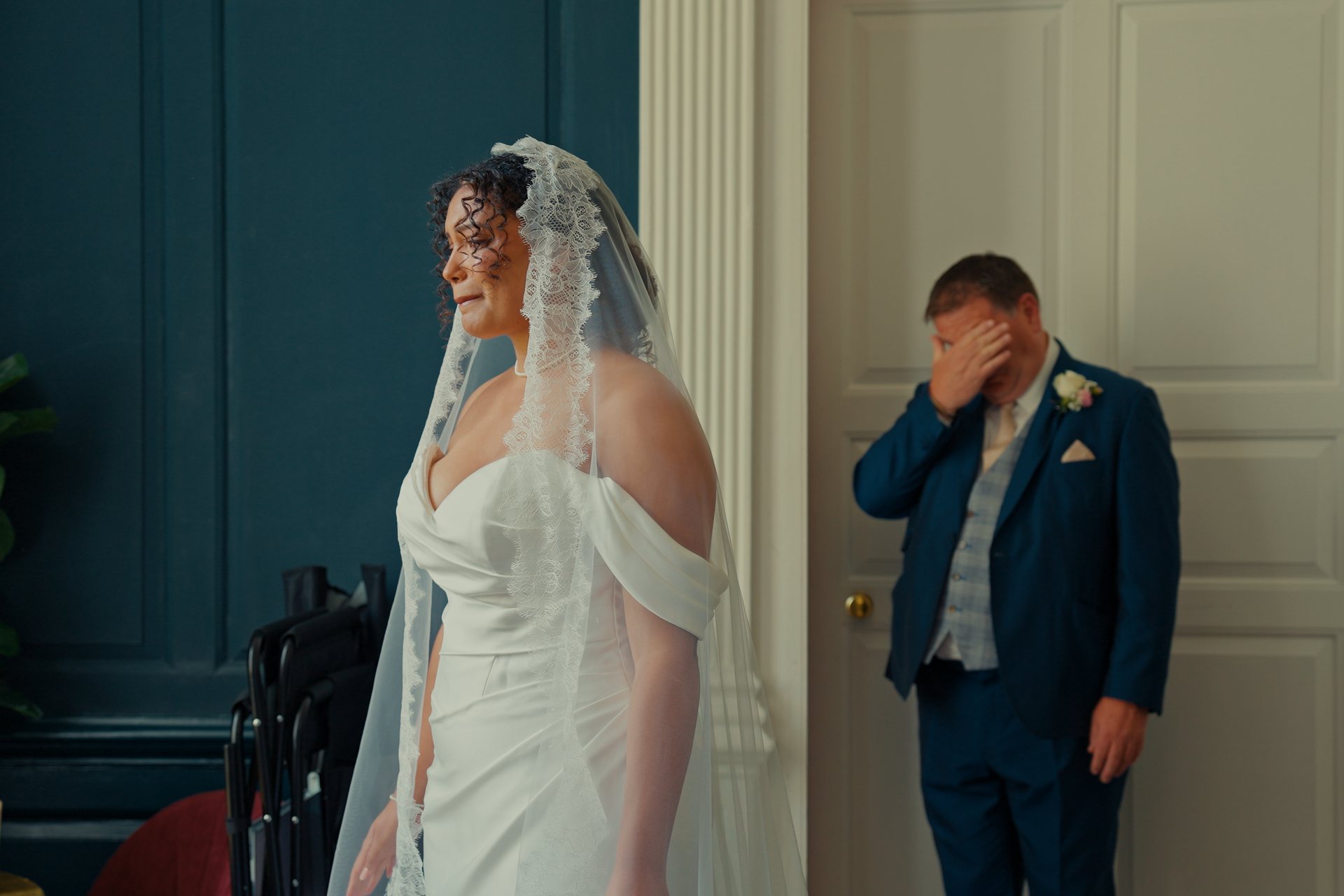 A father overcome with emotion as he sees his daughter